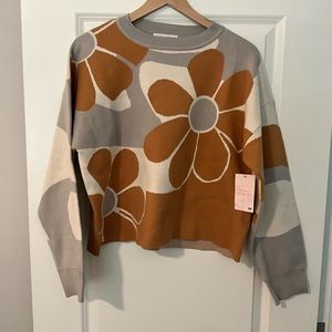 Neutral Ground flowered sweater.